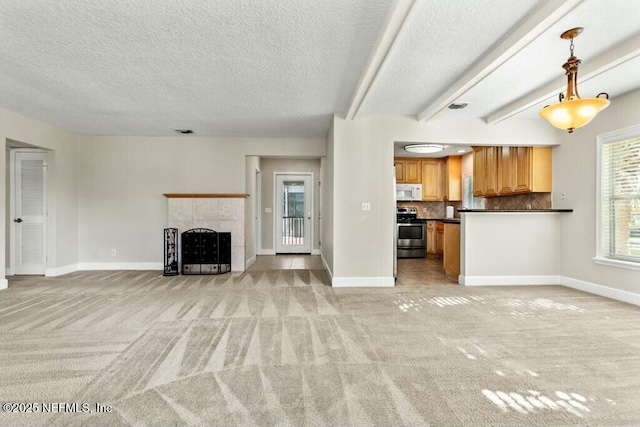 3434 Blanding Blvd Unit 201, Jacksonville, FL 32210 - unfurnished living room featuring light carpet, baseboards, and a fireplace