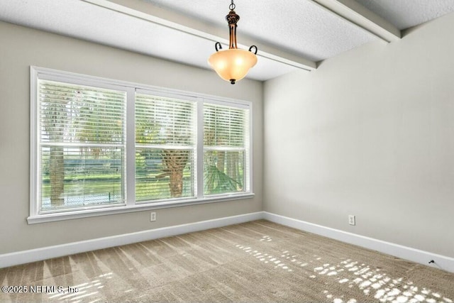 3434 Blanding Blvd Unit 201, Jacksonville, FL 32210 - carpeted spare room featuring baseboards, beam ceiling, and a textured ceiling