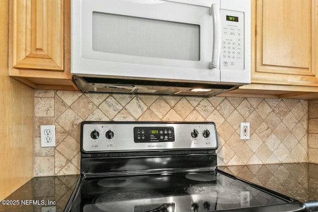 3434 Blanding Blvd Unit 201, Jacksonville, FL 32210 - kitchen with electric range, dark countertops, white microwave, and backsplash