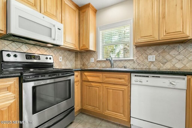 3434 Blanding Blvd Unit 201, Jacksonville, FL 32210 - kitchen featuring a sink, dark countertops, and white appliances