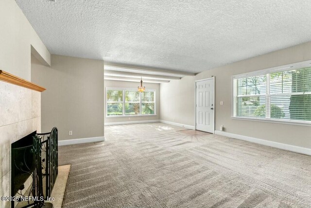 3434 Blanding Blvd Unit 201, Jacksonville, FL 32210 - unfurnished living room featuring baseboards, carpet flooring, and a fireplace