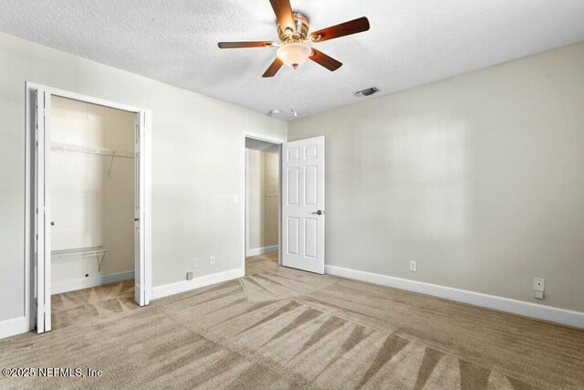 3434 Blanding Blvd Unit 201, Jacksonville, FL 32210 - unfurnished bedroom featuring a closet, carpet floors, a textured ceiling, baseboards, and visible vents