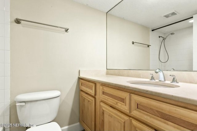3434 Blanding Blvd Unit 201, Jacksonville, FL 32210 - full bathroom with visible vents, toilet, tiled shower, and vanity