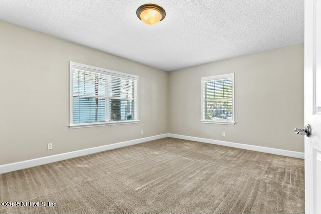 3434 Blanding Blvd Unit 201, Jacksonville, FL 32210 - carpeted empty room featuring baseboards and a textured ceiling