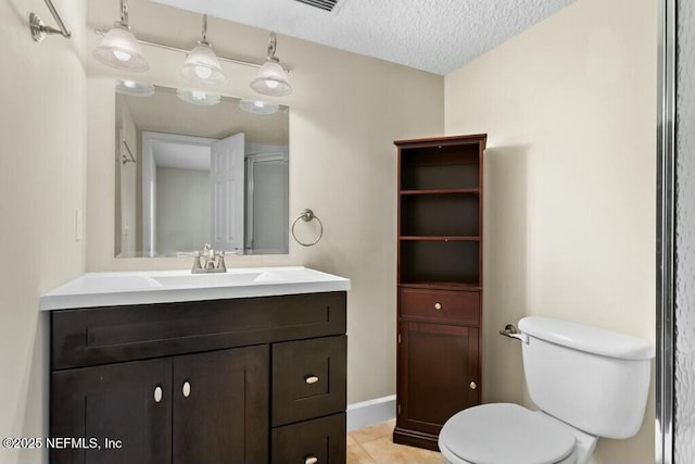 3434 Blanding Blvd Unit 201, Jacksonville, FL 32210 - bathroom featuring tile patterned floors, toilet, vanity, a textured ceiling, and baseboards