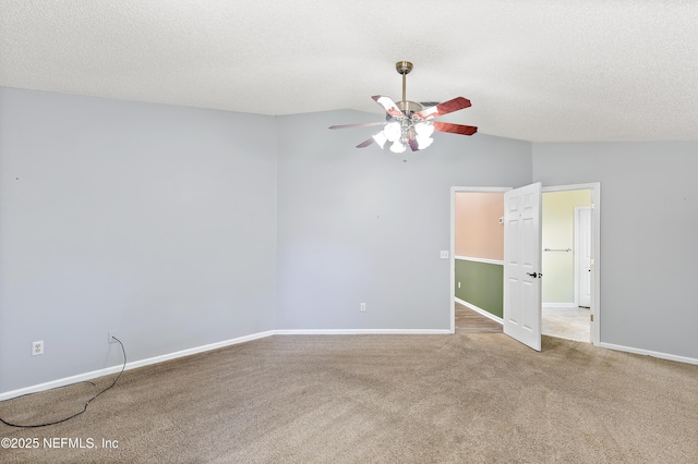 3387 Guernsey Ct, Jacksonville, FL 32226 - carpeted empty room featuring vaulted ceiling, baseboards, a textured ceiling, and a ceiling fan