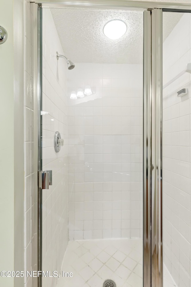 3387 Guernsey Ct, Jacksonville, FL 32226 - full bathroom with a textured ceiling and a stall shower