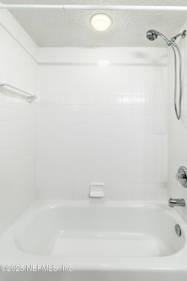 3387 Guernsey Ct, Jacksonville, FL 32226 - full bath with shower / bath combination and a textured ceiling