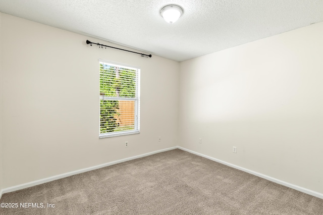 3387 Guernsey Ct, Jacksonville, FL 32226 - carpeted empty room with baseboards and a textured ceiling