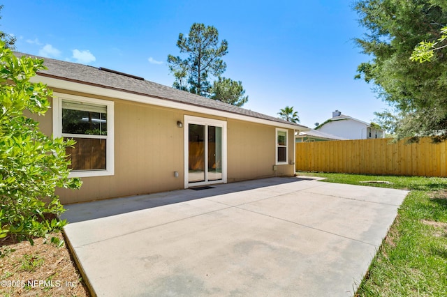 3387 Guernsey Ct, Jacksonville, FL 32226 - rear view of house with a patio area and fence