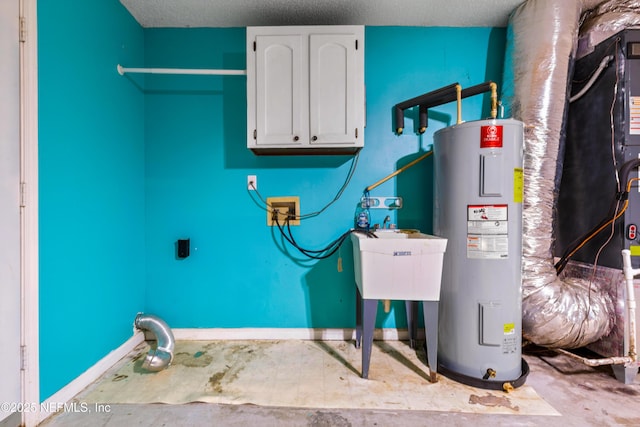 3387 Guernsey Ct, Jacksonville, FL 32226 - utilities with electric water heater and a sink
