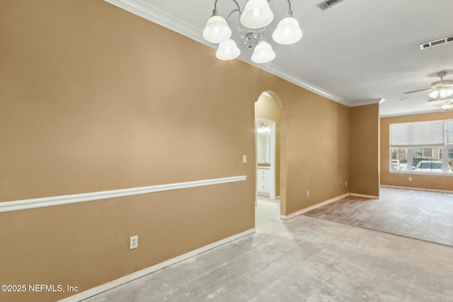 spare room featuring ornamental molding, ceiling fan with notable chandelier, baseboards, arched walkways, and visible vents