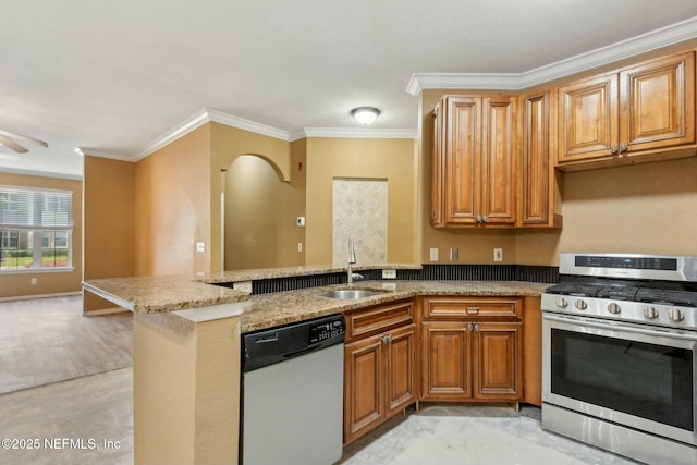 kitchen with a sink, stainless steel gas range, light stone countertops, dishwasher, and a peninsula