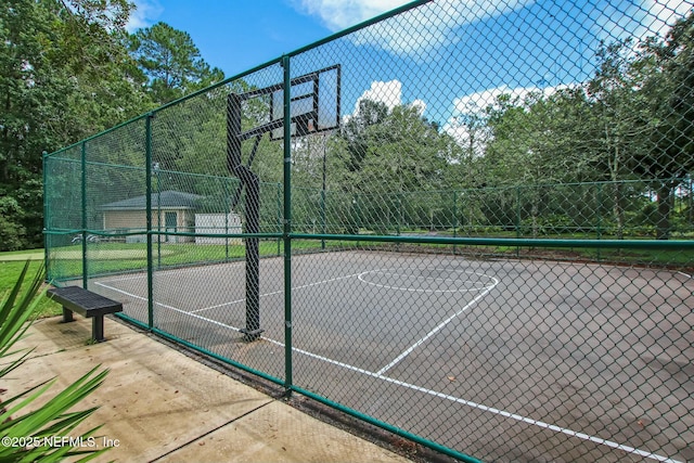 view of sport court featuring community basketball court and fence
