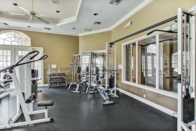 exercise room featuring visible vents, crown molding, baseboards, a ceiling fan, and french doors