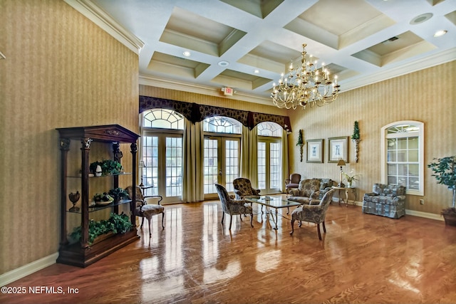 dining room with baseboards, a towering ceiling, wallpapered walls, and french doors