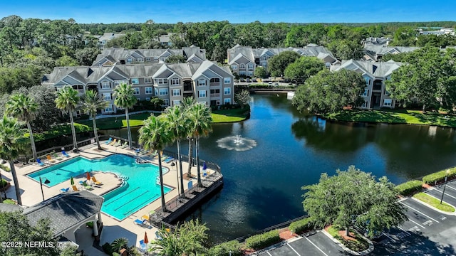 drone / aerial view with a residential view and a water view