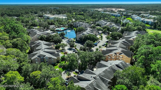 aerial view with a water view, a residential view, and a wooded view