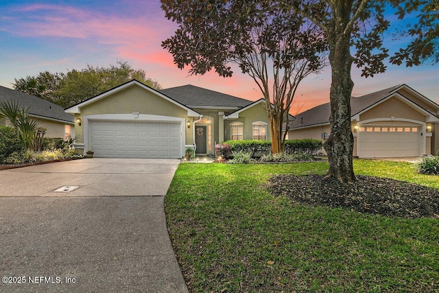 1524 Austin Ln, Saint Augustine, FL 32092 - single story home with stucco siding, an attached garage, a yard, and concrete driveway