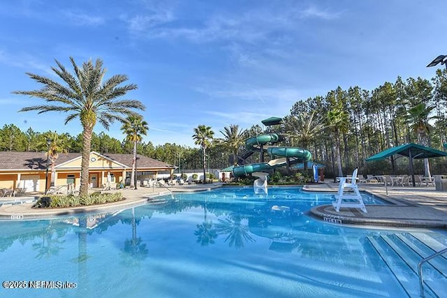 745 Austin Pl, Saint Johns, FL 32259 - community pool with a water slide and a patio area