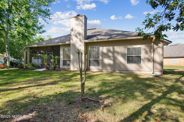 745 Austin Pl, Saint Johns, FL 32259 - back of property with a chimney, a lawn, a shingled roof, and a sunroom