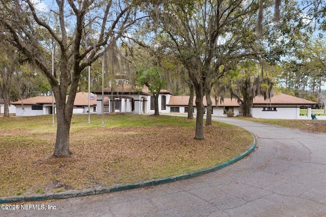 745 Austin Pl, Saint Johns, FL 32259 - view of front of property with a front lawn and curved driveway