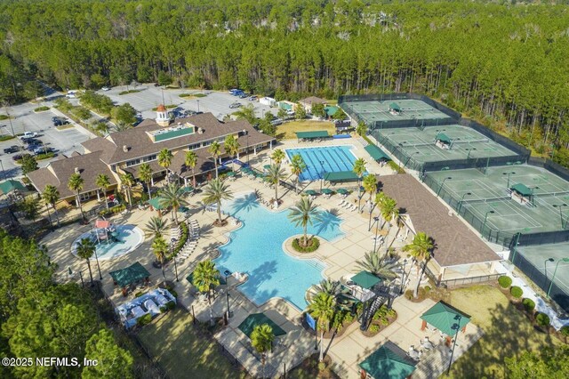 745 Austin Pl, Saint Johns, FL 32259 - drone / aerial view of a pool area and a heavily wooded area