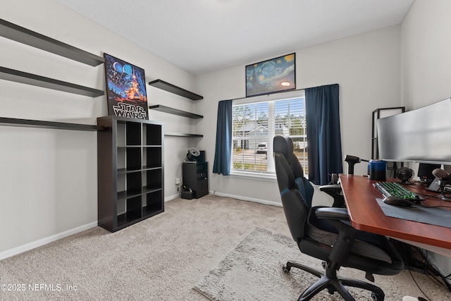 home office with baseboards and carpet floors