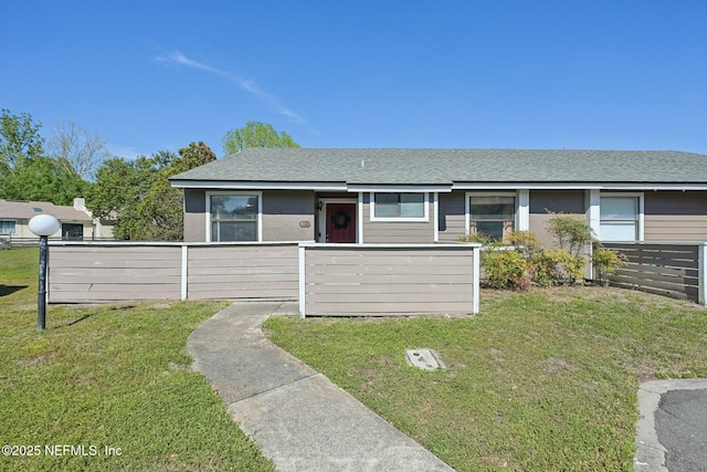 8314 Derbyshire Pl, Jacksonville, FL 32244 - ranch-style home with a front yard, a fenced front yard, and a shingled roof