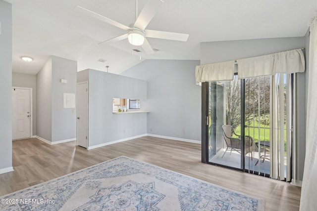 8314 Derbyshire Pl, Jacksonville, FL 32244 - living area with ceiling fan, wood finished floors, and vaulted ceiling