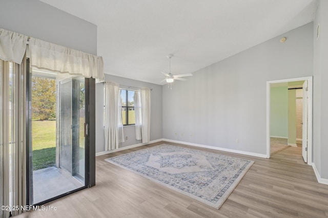 8314 Derbyshire Pl, Jacksonville, FL 32244 - spare room featuring baseboards, lofted ceiling, a ceiling fan, and light wood-type flooring