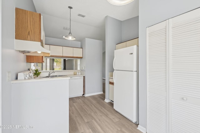 8314 Derbyshire Pl, Jacksonville, FL 32244 - kitchen featuring light countertops, light wood-type flooring, white appliances, a sink, and visible vents