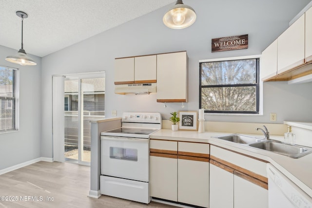 8314 Derbyshire Pl, Jacksonville, FL 32244 - kitchen with vaulted ceiling, light countertops, a sink, under cabinet range hood, and white appliances