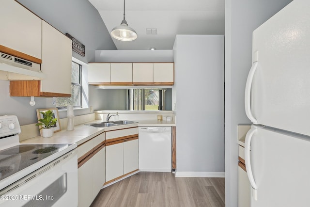 8314 Derbyshire Pl, Jacksonville, FL 32244 - kitchen with light countertops, a sink, under cabinet range hood, white appliances, and white cabinets