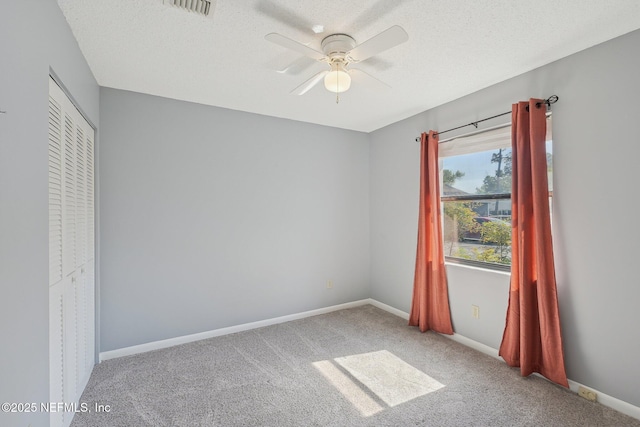 8314 Derbyshire Pl, Jacksonville, FL 32244 - unfurnished bedroom with baseboards, carpet flooring, a textured ceiling, and visible vents