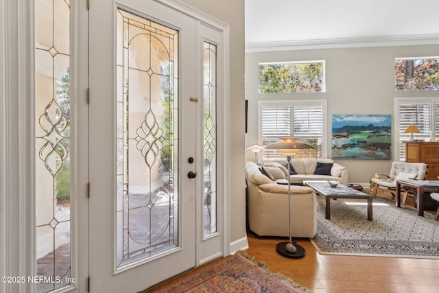 95062 Mackinas Cir, Fernandina Beach, FL 32034 - foyer entrance with wood finished floors and ornamental molding