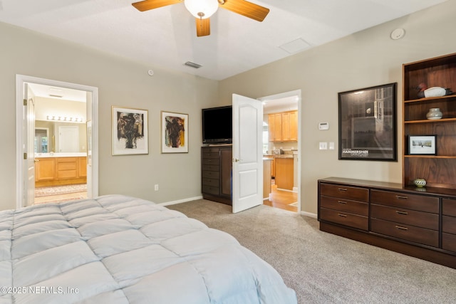 95062 Mackinas Cir, Fernandina Beach, FL 32034 - bedroom featuring visible vents, baseboards, ceiling fan, ensuite bath, and light colored carpet