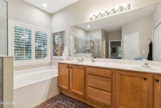 95062 Mackinas Cir, Fernandina Beach, FL 32034 - ensuite bathroom featuring double vanity, a sink, a garden tub, and a shower stall