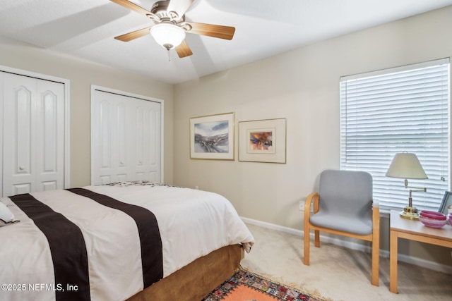 95062 Mackinas Cir, Fernandina Beach, FL 32034 - bedroom with baseboards, multiple closets, a ceiling fan, and carpet