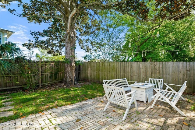 29 Grant St, Saint Augustine, FL 32084 - view of patio / terrace featuring an outdoor fire pit and a fenced backyard