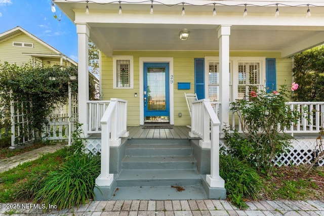 29 Grant St, Saint Augustine, FL 32084 - doorway to property featuring covered porch