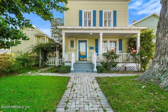 29 Grant St, Saint Augustine, FL 32084 - view of front of home with a porch and a front yard