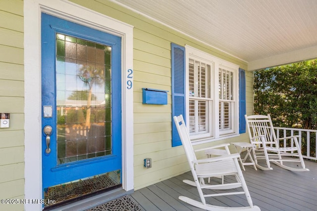 29 Grant St, Saint Augustine, FL 32084 - doorway to property featuring covered porch