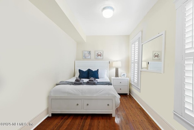 29 Grant St, Saint Augustine, FL 32084 - bedroom featuring dark wood-style flooring and baseboards
