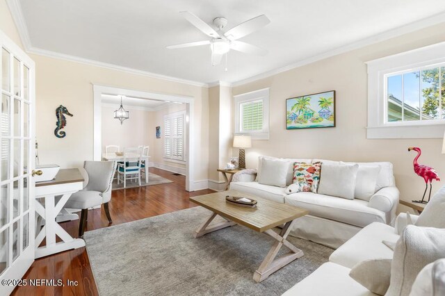 29 Grant St, Saint Augustine, FL 32084 - living area with plenty of natural light, ornamental molding, wood finished floors, baseboards, and ceiling fan