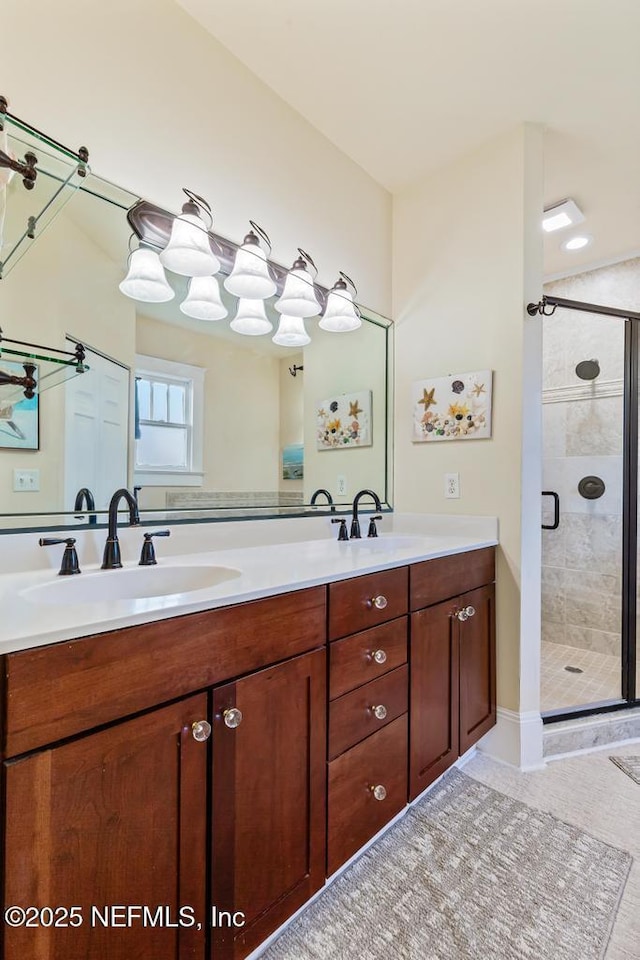29 Grant St, Saint Augustine, FL 32084 - bathroom featuring a shower stall, double vanity, and tile patterned floors