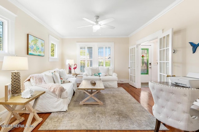 29 Grant St, Saint Augustine, FL 32084 - living room featuring wood finished floors, ceiling fan, crown molding, french doors, and baseboards