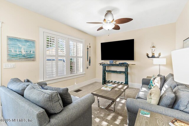 29 Grant St, Saint Augustine, FL 32084 - living room with a ceiling fan, carpet flooring, and baseboards