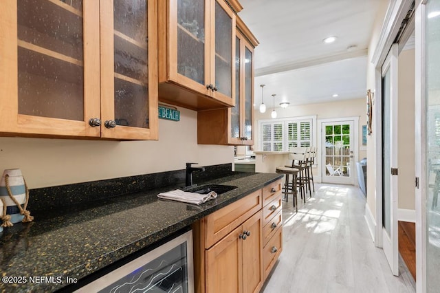 29 Grant St, Saint Augustine, FL 32084 - bar area featuring light wood-style floors, recessed lighting, wine cooler, and a sink