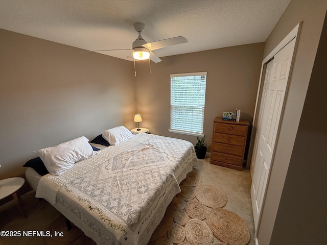 3118 Steeple Pine Ct, Middleburg, FL 32068 - bedroom featuring a closet, light colored carpet, a textured ceiling, and ceiling fan